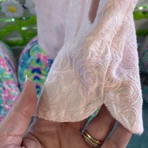 Light pink textured fabric shorts